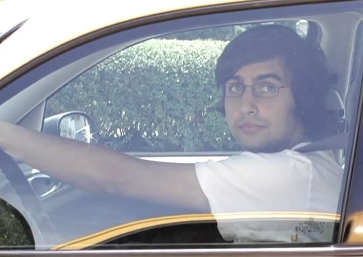 a picture of a (hopeful?) Zubin Sedghi in a car, comes from the YouTube video Honk War.