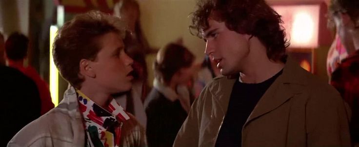 The two Emerson sons arguing at the boardwalk, movie is The Lost Boys
